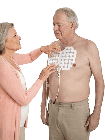 Image of a woman placing transducer arrays on a man's chest